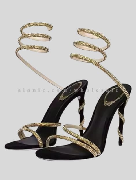 black stilettos with ankle wrap gold strap vendor